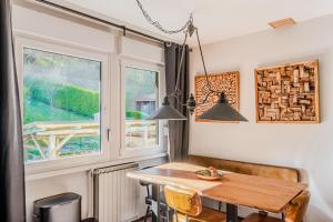 a dining room with a table and a window at Hisa Lina near Bovec in Srpenica