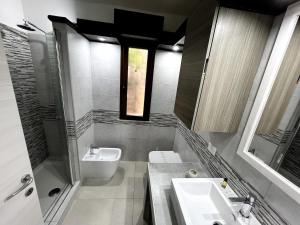 a bathroom with a sink and a toilet at Casa Cristina in Costa Rei +16 photos