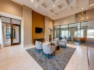 a living room with couches and chairs on a rug at Landing Incredible 2BD Gym in New Caney