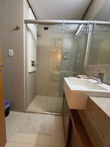 a bathroom with a sink and a shower at 710 A Hotel Home Jade in Brasília +10 photos
