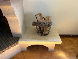 a wooden chair sitting on a bench next to a wall at The Urban Terrace in Figueira da Foz