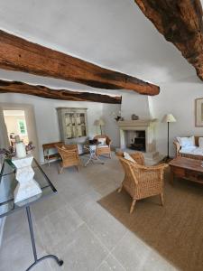 a living room filled with furniture and a fireplace at La Ribaude in Crestet