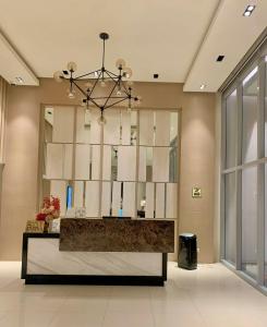 a lobby with a reception desk in a building at The SB Residences Luxury Executive Studio in Iloilo City +54 photos