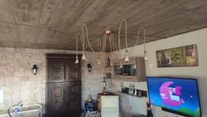 a kitchen with a refrigerator and a ceiling at Chez igor in Pétange +11 photos