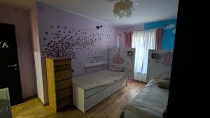 a small room with a bed and a window at Chez igor in Pétange