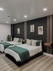 a bedroom with two beds with green and white at Casa Madrisqui Heated Pool Oasis 12 Guests Midway Keys & Miami in Homestead +68 photos