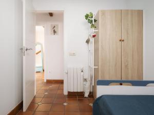 a bedroom with a blue bed and a white cabinet at Casa Costaneira in Boiro +65 photos
