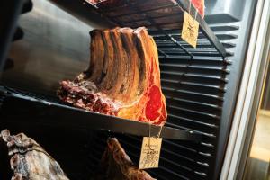 a piece of meat is being cooked in an oven at U Pana domácího in Zlín