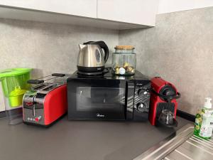 a kitchen with a toaster and a toaster oven at Casa Simonetta in Laveno-Mombello