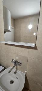 a bathroom with a toilet and a sink in it at Boka Bay in Tivat +55 photos