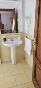 a bathroom with a sink and a mirror at HAIZEA Aire Apartamento 4 in Sopuerta
