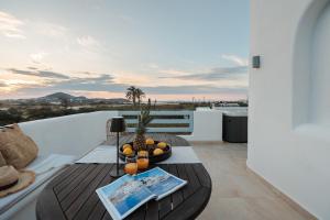 a balcony with a table and a view at Villas vaya in Naxos Chora
