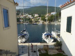 a group of boats are docked in a marina at Costa's House in Kiónion