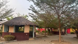 a small building with a thatch roof at SimHan Luxury Hotel & Resort Jengre in Jengre