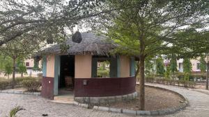 a small house with a grass roof at SimHan Luxury Hotel & Resort Jengre in Jengre