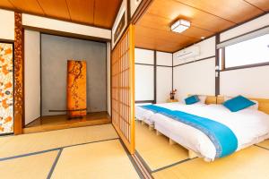 a bedroom with two beds in a room at Goen in Iwaki +42 photos