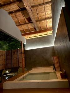 a room with a stage with a wooden ceiling at TIMeSCAPE -hakone- in Miyanoshita +38 photos