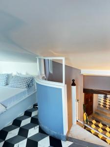 a living room with a bed and a fireplace at La Masia in Portovenere