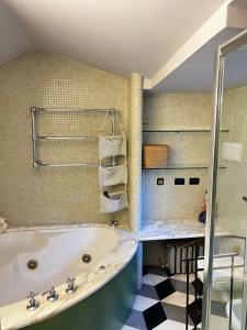 a bathroom with a tub and a sink at La Masia in Portovenere +18 photos
