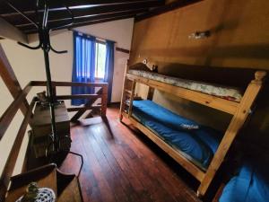 a room with two bunk beds and a camera at Cabañas Desde Las Estrellas in Merlo +47 photos
