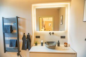a bathroom with a sink and a mirror at ART&SPA Koblenz in Koblenz +31 photos