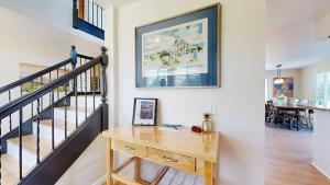 a home office with a wooden desk next to a staircase at Dog Friendly Oceanfront Home with Hot Tub & Views in Fort Bragg