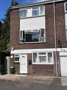 a brick house with a window and a door at Self-contained Studio Slough, Berkshire in Canvey