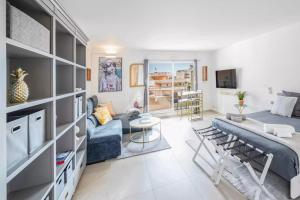 a living room with a couch and a table at New Large Studio - Monaco Border - Sea View - Lift - Parking included in Beausoleil