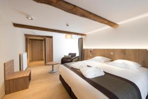 Postel nebo postele na pokoji v ubytování Hotel Le Fournil