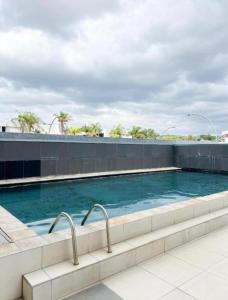 a swimming pool on top of a building at Jubilee Stay in Windhoek