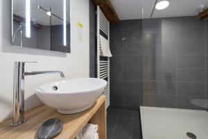Koupelna v ubytování Hotel Le Fournil