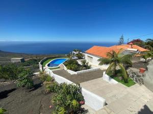 an aerial view of a house with a swimming pool at Apartamentos Finca Colon in Los Quemados