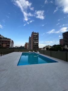 a swimming pool on the roof of a building at Depto. PREMIUM Barrio Norte in San Miguel de Tucumán
