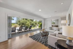 a living room with a couch and a table at Haven With Pool, Hot Tub And Tastings Included in Healdsburg