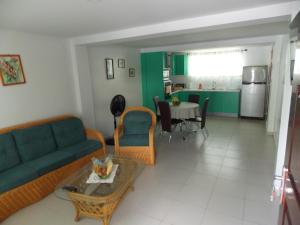 a living room with a couch and a table at At Rachel in Paramaribo