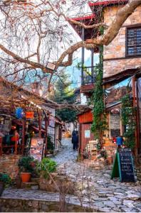 a stone walkway in front of a building at Seaside Stay Makrygialos in Makrygialos
