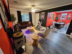 a living room with a dog laying on a rug at 3BR Houston with Grill, Hot Tub and Game Room near NRG, Downtown and Hobby Airport in Houston
