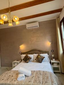 a bedroom with a white bed with two pillows at Venice Star Villa in Mestre +33 photos
