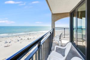 a balcony with a view of the beach at Beautifully Decorated Condo with Amzing Ocean View in Myrtle Beach +68 photos