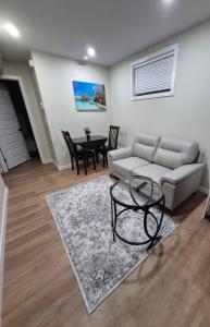 a living room with a couch and a table at Clear Edge Suites in Saskatoon