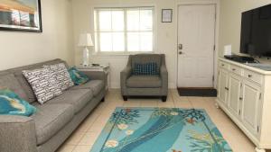 a living room with a couch and a chair at Condo At The Cove Unit 5 in Cape May