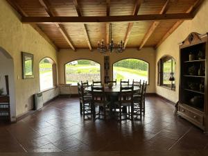 a dining room with a table and chairs at Casa Tafi del Valle in Tafí del Valle