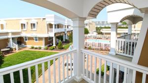 a view from the balcony of a home with a pool at 215 Heritage Lane in Cape May