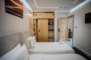 a living room with two beds and a couch at Villa America Dakhla in Dakhla +152 photos