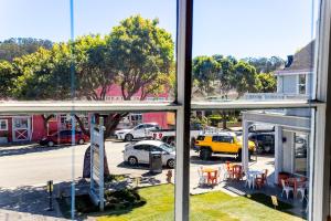 a view of a parking lot from a window at BytheSea Inn in Half Moon Bay