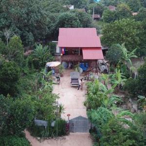 an overhead view of a building with a red roof at Authentic Cambodian Angkor Cottage in Siem Reap