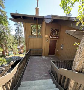 a stairway leading to the front of a building at The Icelander at Mammoth Point in Mammoth Lakes