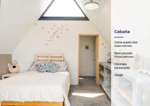 a bedroom with a bed and a skylight at Portal M Chalets in Chalma