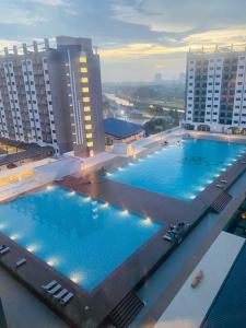 a large swimming pool on top of a building at SeFA Cozy Stay in Malacca