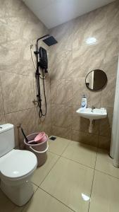 a bathroom with a toilet and a sink at SeFA Cozy Stay in Malacca +24 photos
